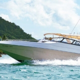 Twin engine speedboat cruising in between the islands of Phuket